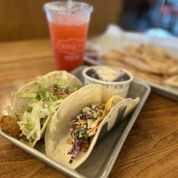 Tacos 4 Life signature dishes Korean BBQ Taco, Fried Chicken Taco, Ultimate Trio (queso, salsa, guacamole), Mango Habanero Taco